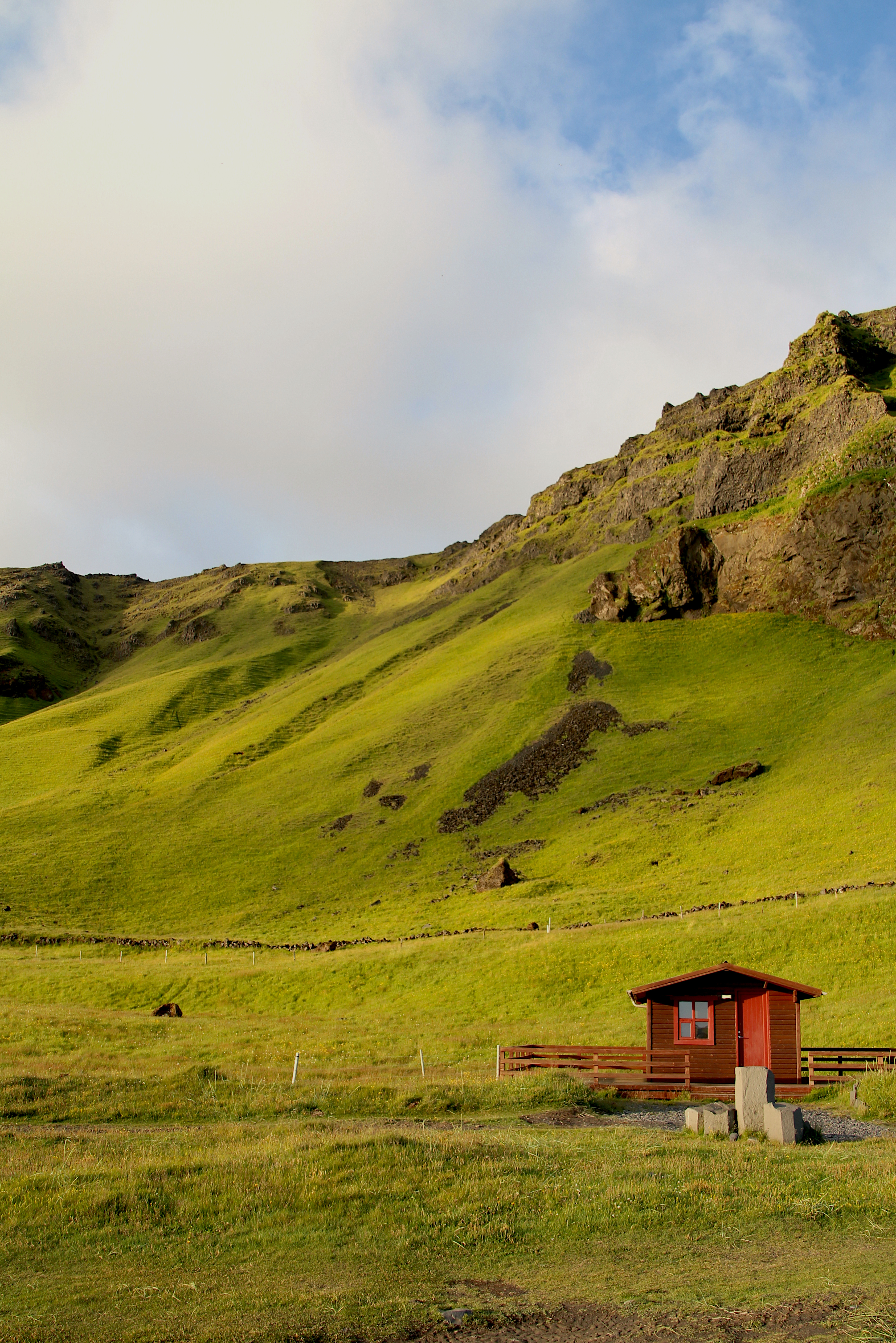 Icelandic landscape with an outhouse in the foreground